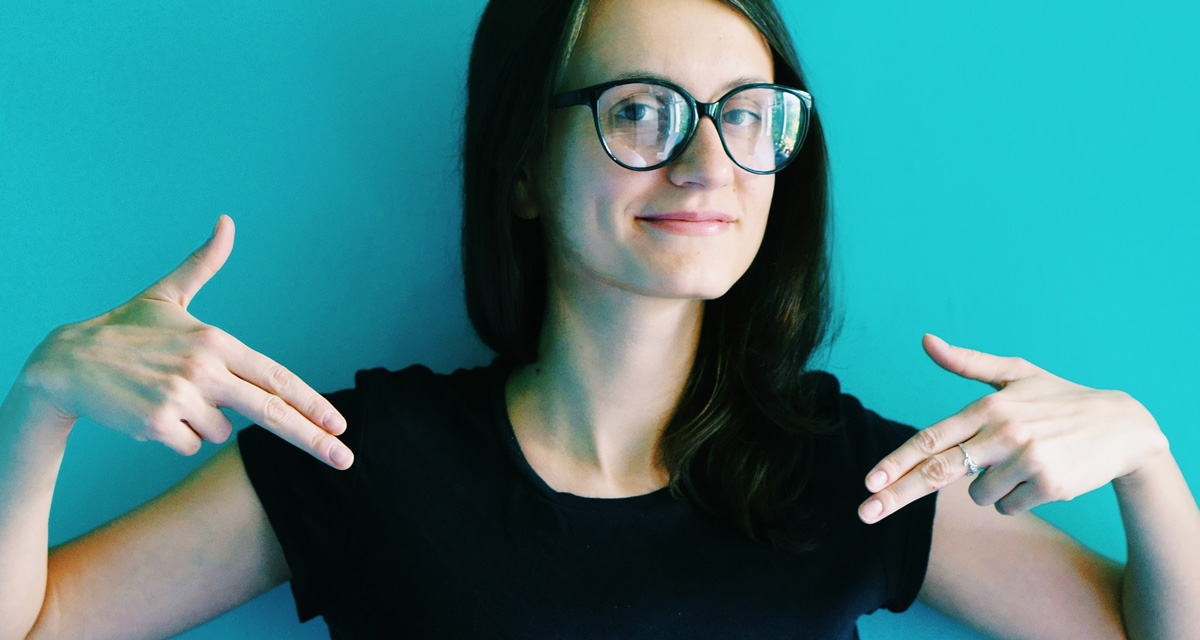 Woman pointing at herself