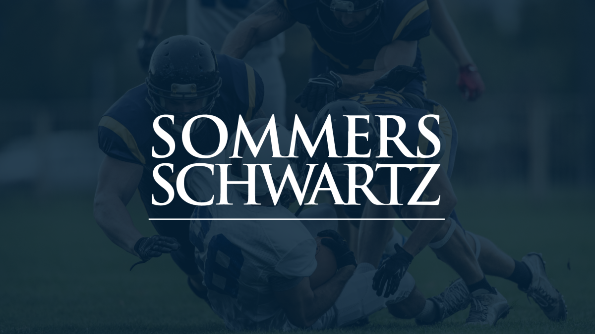 Sommers Schwartz logo overlaid on a darkened photo of football players tackling during a game