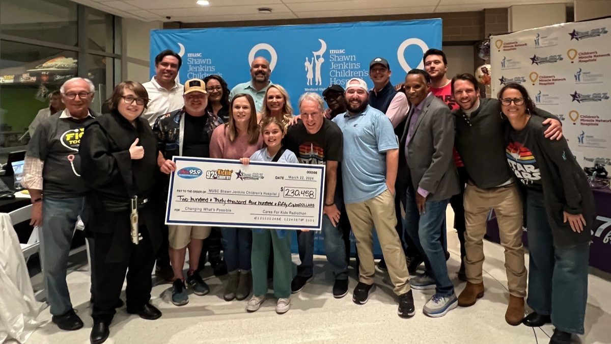 Steinberg Law Firm Champions Pediatric Care: Helps Raise Over $230K for MUSC Shawn Jenkins Children’s Hospital 3 Group of people holding a large donation check for $230,458 to MUSC Shawn Jenkins Children's Hospital at a radiothon fundr...