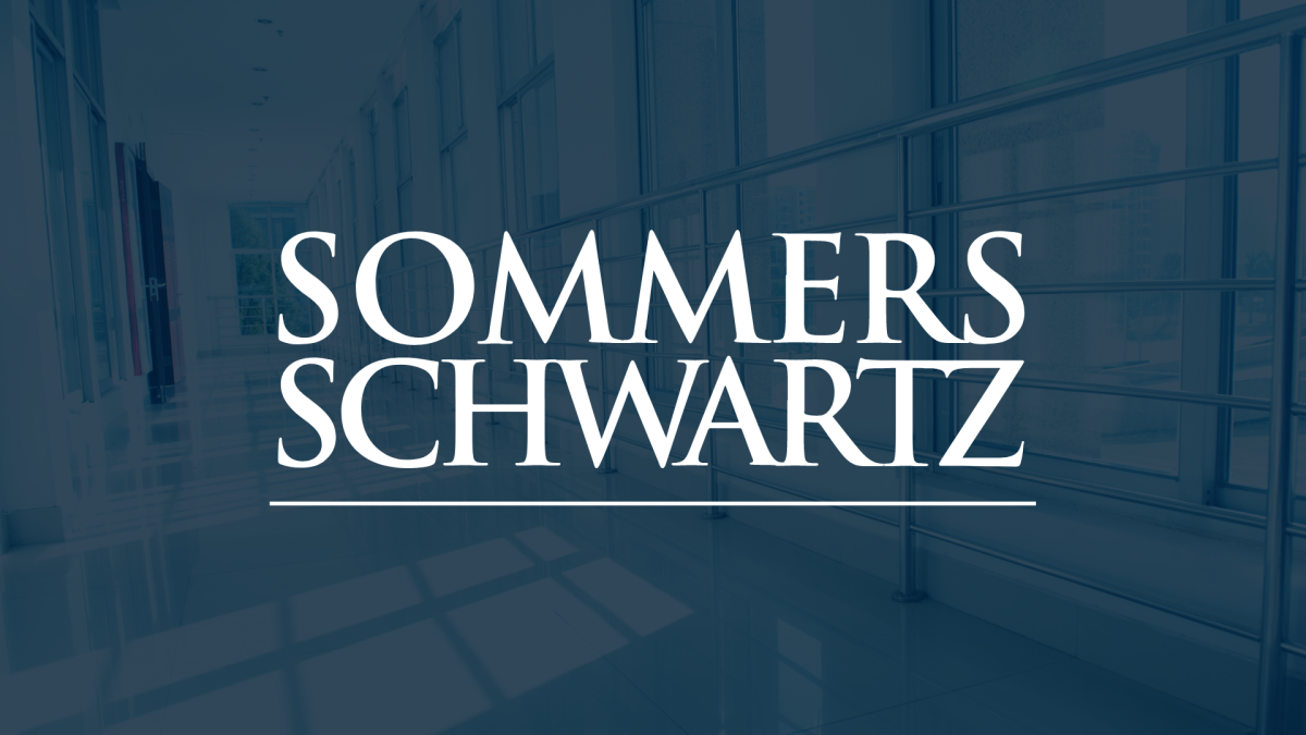 Sommers Schwartz law firm logo in white serif text over a blue-tinted courthouse hallway background