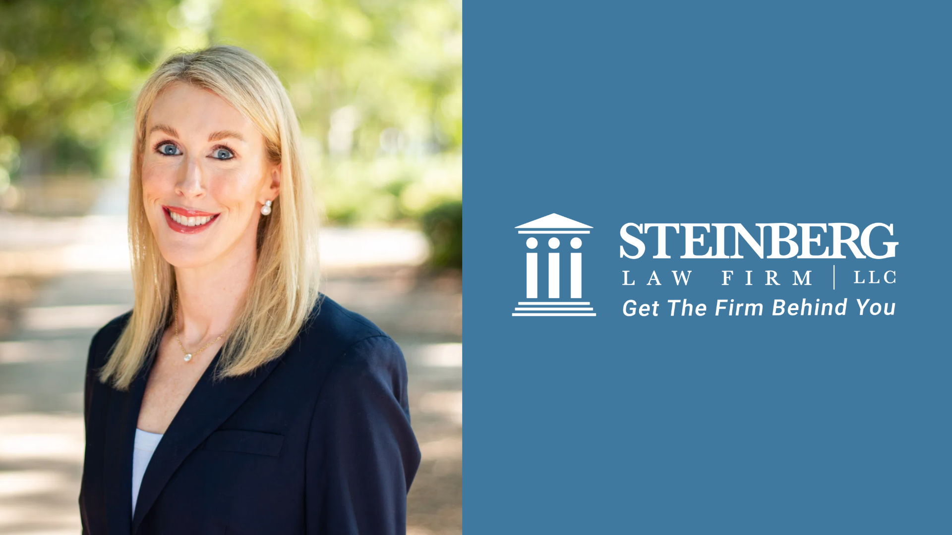 Smiling blonde woman in a navy blazer beside the Steinberg Law Firm LLC logo and tagline "Get The Firm Behind You