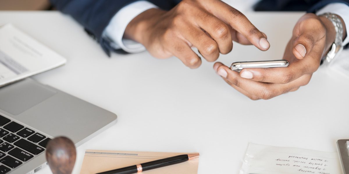 Close up of man tapping a link on his phone