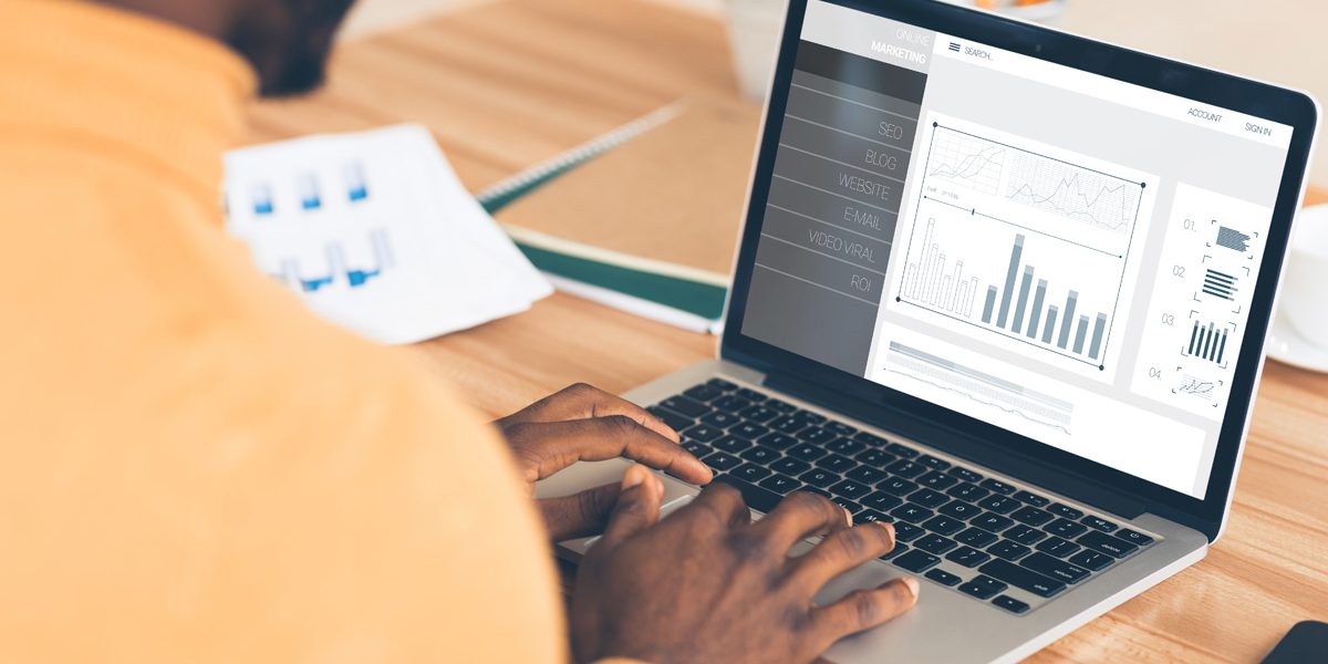 Man looking at press release website analytics